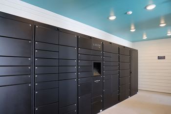 a bunch of lockers in a room with a blue ceiling